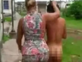 Screengrabs from a video circulated on social media captured a wife dragging her husband’s naked lover outside and made her walk through the streets in Brazil. (SOCIAL MEDIA)