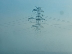 A power line is seen through heavy for off of the Anthony Henday near 17 street in Edmonton, Alta., on Wednesday, Nov. 27, 2013. Tom Braid/Edmonton Sun