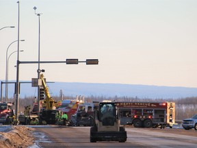 Emergency workers at the scene of a collision involving five vehicles and one semi-truck at the corner of Highway 63 and MacKenzie Boulevard on Saturday, February 11, 2017. Vincent McDermott