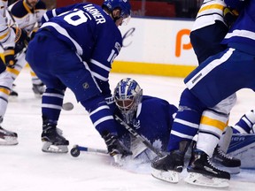 Leafs goalie Frederik Andersen tries to keep the puck out of the net as the Buffalo Sabres swarm the crease at the Air Canada Centre in Toronto February 11, 2017. (Michael Peake/Toronto Sun/Postmedia Network)