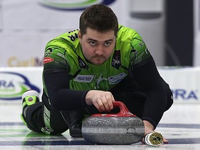 Skip Matt Dunstone delivers a stone during the Viterra provincial men’s curling championship in Portage la Prairie. (Kevin King/Winnipeg Sun)