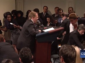 White House Press Secretary Sean Spicer (Melissa McCarthy) tries to run down the press corps on a motorized podium in the cold open for the Feb. 11, 2017, episode of "Saturday Night Live."