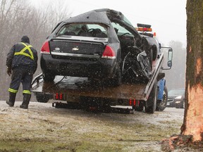 One man was killed and another injured when this car left a slushy Elgin Road in Thames Centre and hit a tree Sunday morning, police say. The cause of the crash is under investigation and the name of the victim and the injured man?s condition were not immediately available. (MIKE HENSEN, The London Free Press)