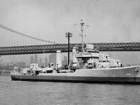 This undated file photo provided by the U.S. Navy shows the USS Turner on the East River in New York City near the Williamsburg Bridge. The USS Turner exploded and sank in 1944 and more than 130 of its sailors are still listed as missing. The Pentagon said that it will try to determine if dozens of sailors listed as missing were actually recovered and buried all along as unknowns in a New York cemetery. (U.S. Navy via AP, File)