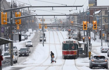 Traffic on St Clair Ave West near Oakwood during a Sunday morning snowfall on Sunday February 12, 2017. Michael Peake/Toronto Sun/Postmedia Network