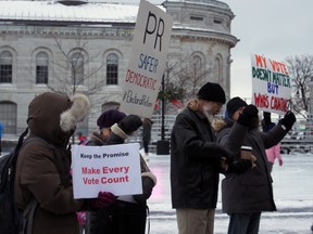 About 50 people were at Springer Market Square on Saturday to protest the federal government's decision to not go ahead with electoral reform. (Steph Crosier/The Whig-Standard)