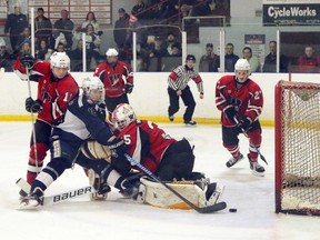 Woodstock Navy Vets forward Dylan Wettlaufer, left, scores the winning goal on a rebound off Wellesley Applejacks goalie Ryan Hergott in Wellesley, Ont. on Sunday February 12, 2017 during their Provincial Junior Hockey League quarter-final. The Vets won 5-4 in overtime after losing Games 3 and 4. Game 6 is Friday in Woodstock (Greg Colgan/Woodstock Sentinel-Review)