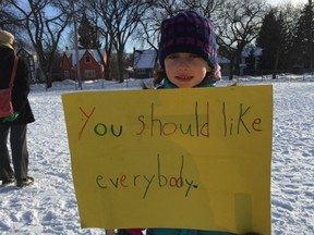 Seven-year-old Una Rumstein Fine makes her feelings with a home-made sign at a solidarity vigil on the Wolseley School grounds on Sunday, Feb. 12, 2017. Organized by area residents Sally Papso and Marianne Cerilli, the vigil was in reaction to an incidence earlier this year when a rock with an anti-Semitic slur was left on the front door of a family in Wolseley.
GLEN DAWKINS/Winnipeg Sun/Postmedia Network