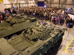 A $404-million federal deal to upgrade LAVIII armoured vehicles like these, above, will secure 250 jobs at London?s General Dynamics plant and reassure workers nervous about slowing production, company and union officials say. (Free Press file photo)