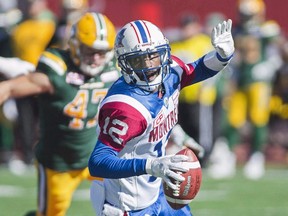 Montreal Alouettes quarterback Rakeem Cato breaks away from a tackle during a CFL game against the Edmonton Eskimos on Oct. 10, 2016. (THE CANADIAN PRESS/Graham Hughes)