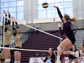 Cassidy Kinsella launches one of her game-high 25 kills for the MacEwan Griffins on Saturday, Feb. 11. (Chris Piggott/MacEwan Athletics)