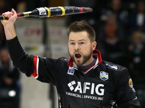 Skip Mike McEwen celebrates after his final rock in the 10th end of the Viterra provincial men's curling championship final in Portage la Prairie, Man., on Feb. 12, 2017. (Kevin King/Winnipeg Sun/Postmedia Network)