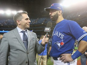 Jose Bautista of the Toronto Blue Jays is interviewed by Sportsnet's Barry Davis after their victory against the Kansas City Royals during Game 5 of the ALCS at Rogers Centre on Oct. 21, 2015. (Tom Szczerbowski/Getty Images)