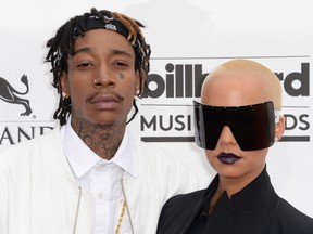 Rapper Wiz Khalifa (L) and model Amber Rose arrive for the 2014 Billboard Music Awards, May 18, 2014 at the MGM Grand Garden Arena, in Las Vegas, Nevada.(ROBYN BECK/AFP/Getty Images)