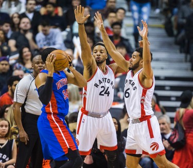 Toronto Raptors Norman Powell and Cory Joseph  during 1st half action against Detroit Pistons Tobias Harris at the Air Canada Centre in Toronto, Ont. on Sunday February 12, 2017. Ernest Doroszuk/Toronto Sun/Postmedia Network