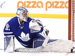 A puck gets past Leafs goalie Frederik Andersen during Toronto’s 3-1 loss to the Sabres on Saturday. Andersen likely gets the start at home to the Islanders on Tuesday, while back-up Curtis McElhinney probably goes against his former team in Columbus on Wednesday. (The Canadian Press)