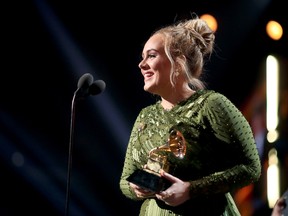 Singer Adele accepts the award for Song of The Year for "Hello" during The 59th GRAMMY Awards at STAPLES Center on February 12, 2017 in Los Angeles, California. (Photo by Christopher Polk/Getty Images for NARAS)