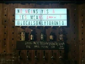A sign at Locals Only Toronto sparked furor online. (Twitter)