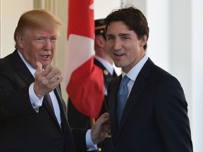 U.S. President Donald Trump (L) greets Prime Minister Justin Trudeau upon arrival outside of the West Wing of the White House on February 13, 2017 in Washington, D.C. (MANDEL NGAN/AFP/Getty Images)
