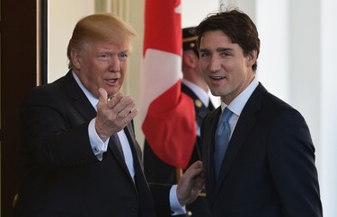 U.S. President Donald Trump (L) greets Prime Minister Justin Trudeau upon arrival outside of the West Wing of the White House on February 13, 2017 in Washington, D.C. (MANDEL NGAN/AFP/Getty Images)
