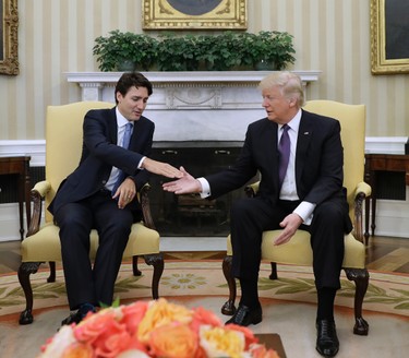 U.S. President Donald Trump shakes hands with Prime Minister Justin Trudeau in the Oval Office of the White House in Washington, Monday, Feb. 13, 2017. (AP Photo/Evan Vucci)