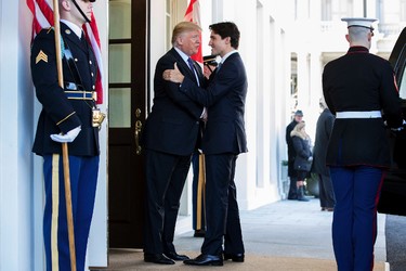 U.S. President Donald Trump welcomes Prime Minister Justin Trudeau outside the West Wing of the White House in Washington, Monday, Feb. 13, 2017. (AP Photo/Andrew Harnik)