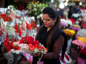 A girl buys flowers to celebrate Valentine's Day in Islamabad, Pakistan, on Monday, Feb. 13, 2017. A Pakistani judge has banned Valentine's Day celebrations in the country's capital, saying they are against Islamic teachings. (B.K. Bangash/AP Photo)