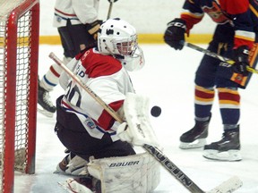 Wallaceburg Midget AE goalie Hunter Shipman makes a blocker save against Mt. Brydges on Friday, February 9, at Wallaceburg Memorial Arena. Mt. Brydges won the game 6-0 and won again on Sunday to take a 4-0 points lead in their OMHA quarterfinal six-point series.