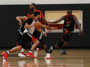 Toronto Raptors Corey Joseph is chased by teammate Norman Powell during a spirited practice in preparation for their game in Chicago against the Bulls on Tuesday night.in Toronto, Ont. on Monday February 13, 2017. Jack Boland/Toronto Sun/Postmedia Network