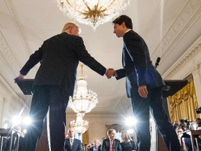 U.S. President Donald Trump and Canadian Prime Minister Justin Trudeau shake hands during a joint press conference in the East Room of the White House on Monday, Feb. 13, 2017 in Washington, DC. (GETTY IMAGES/PHOTO)