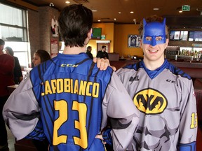 Sudbury Wolves Kyle Capobianco and Michael Pezzetta  unveil Batman jerseys for the Superhero Game in Sudbury, Ont. on Monday February 13, 2017. The Sudbury Wolves will don special Superhero-themed jersey for the second season in a row in supportof local children's charities. Sunday February 19 th when the Wolves host the Niagara Ice Dogs in a 2pm  matinee, the Wolves will wear the nostalgic Batman-themed jerseys which will be auctioned off throughout the game with proceeds going to the NEO Kids Foundation.Gino Donato/Sudbury Star/Postmedia Network