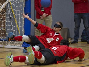 Tony Fraser of the Bytown team reaches for the ball which bounced up from his body during the goal ball event of the 2017 Ontario ParaSport Winter Games held Saturday at the W. Ross Macdonald School for the Blind, from which Fraser graduated. Brian Thompson/Brantford Expositor