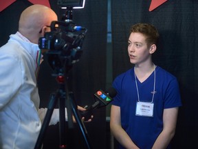 Ambassador Cole Martin is interviewed by a television reporter  during a reception for kids from the Thames Valley Children's Centre at the Western Fair Agriplex on Monday February 13, 2017. The sports celebrities will be featured at the Rogers Sports Celebrity Dinner & Auction. (MORRIS LAMONT, The London Free Press)