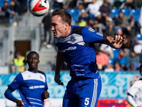 FC Edmonton's Albert Watson (5) heads the ball during a NASL game against the Indy Eleven at Clarke Stadium, in Edmonton on Sunday Oct. 2, 2016.