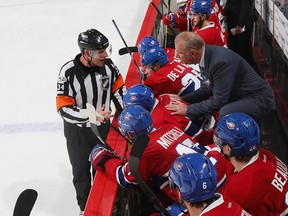 Head coach Michel Therrien of the Montreal Canadiens gets an explanation from referee Brad Meier during an NHL game at the Wells Fargo Center on Feb. 2, 2017. (Bruce Bennett/Getty Images)