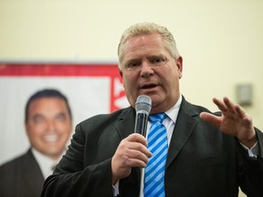 Doug Ford speaks at a town hall meeting in Toronto on Monday, Feb. 13, 2017. Ford said he was " going to run in 2018 either municipally or provincially, depending on where the people need me the most." (CRAIG ROBERTSON/TORONTO SUN)