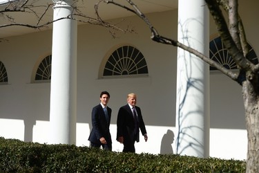 Prime Minister Justin Trudeau walks with U.S. President Donald Trump down the West Wing Colonnade of the White House in Washington, D.C. on Monday, Feb. 13, 2017. THE CANADIAN PRESS/Sean Kilpatrick ORG XMIT: SKP135