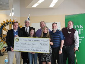 On hand for the cheque presentation were Dan Kaltiainen, of Rotary Club of Sudbury and co-chair of the Blues for Food Organizing Committee, Geoffrey Lougheed, of the Rotary Club of Sudbury and Sudbury Food Bank board member, Jocelyn Filippini, president of the Rotary Club of Sudbury, Brian Kuczma, of Downtown Sudbury and a member of the Blues for Food Organizing Committee, Anna Ghiandoni, manager of @Home Energy, Marc Morin, past-president of the Rotary Club of Sudbury, and Dan Xilon, executive director of the Sudbury Food Bank. Supplied photo