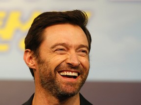 In this March 7, 2016, file photo, actor Hugh Jackman smiles during a press conference in Seoul, South Korea. Jackman posted a selfie on social media Feb. 13, 2017, showing off his bandaged nose following treatment for skin cancer. (AP Photo/Lee Jin-man, File)