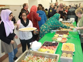 Members of the Sarnia Muslim Association offered food to the 200-plus guests at the Sarnia mosque on Feb. 8. The mosque hosted an interfaith solidarity event for the victims of the Jan. 29 Quebec City mosque attack.
CARL HNATYSHYN/SARNIA THIW EEK