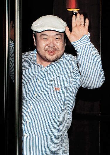 (FILES) In a file picture taken on June 4, 2010 Kim Jong-Nam, the eldest son of North Korean leader Kim Jong-Il, waves after an interview with South Korean media representatives in Macau.  The eldest brother of North Korea's new leader says reforms needed to avert the collapse of the country's economy will lead to the end of its Stalinist regime, according to a book to be published this week. Kim Jong-Nam, the half brother of Kim Jong-Un who took control of the hermit state on the death of their father last month, says the military has become so powerful it will step in and take over.   REPUBLIC OF KOREA OUT    AFP PHOTO / JOONGANG SUNDAY VIA JOONGANG ILBO / FILES (Photo credit should read JoongAng Sunday/AFP/Getty Images)