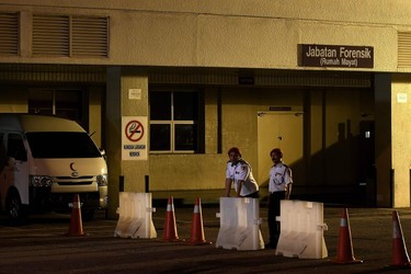 Malaysian private security guards stand guard outside the Forensics department at Putrajaya Hospital in Putrajaya on February 14, 2017, where the body of a North Korean man suspected to be Kim Jong-Nam, half-brother of North Korean leader Kim Jong-Un is believed to be kept.  The half-brother of North Korean leader Kim Jong-Un has been assassinated in Malaysia, South Korean media reported, with one TV station saying he was attacked at the country's main airport with poisoned needles. / AFP PHOTO / MANAN VATSYAYANAMANAN VATSYAYANA/AFP/Getty Images