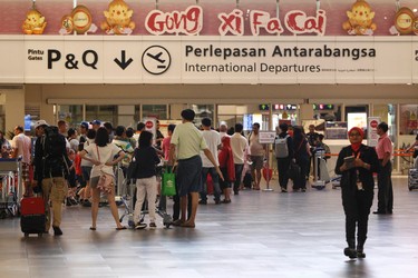 Passengers are queuing up for the security checks at the 2nd Kuala Lumpur International Airport in Sepang, Malaysia on Tuesday, Feb. 14, 2017.  ??Malaysian officials say a North Korean man has died after suddenly becoming ill at Kuala Lumpur's airport. The district police chief said Tuesday Feb. 17, 2017 he could not confirm South Korean media reports that the man was Kim Jong Nam, the older brother of North Korean leader Kim Jong Un. (AP Photo/Daniel Chan) ORG XMIT: XWC101