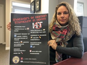 BRUCE BELL/The intelligencer
Lisa Warriner, executive director of Victim Service of Hastings, Prince Edward, Lennox and Addington, is pictured with the new poster being placed in local hotels and motels after staff complete training to recognize the indicators of human trafficking.