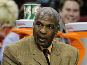 In this Jan. 20, 2011 photo, Charlotte Bobcats assistant coach Charles Oakley watches from the bench in Charlotte, N.C. (AP Photo/Chuck Burton, File)