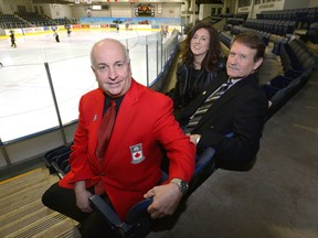Peter Inch, Chair Board of Governors Curling Canada, Cheryl Finn, director Tourism London, and Ted Smith, vice-chair Continental Cup host committee, sit in the Western Fair Sports Centre where the World Financial Continental Cup will be held in 2018. (MORRIS LAMONT, The London Free Press)