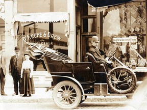 Thomas Drew (left), John Drew, Etta Manning, J.T. O'Keefe is seated in the car, circa 1908. The site of the photo would be the western end of the present-day Zonta Park, King Street, on the north side.