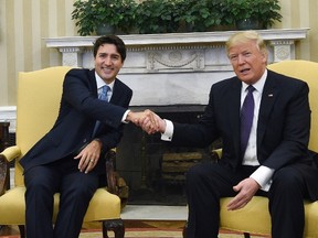Prime Minister Justin Trudeau meets with U.S. President Donald Trump in the Oval Office of the White House in Washington, D.C., on Monday, Feb. 13, 2017. (Sean Kilpatrick/The Canadian Press)