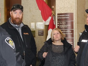 Winnipeg Transit driver Nelson Giesbrecht, left centre, speaks with other drivers on Feb. 14, 2017. Giesbrecht would like to see safety shields installed in transit buses following the fatal attack on a fellow driver earlier that day. (JOYANNE PURSAGA/ Winnipeg Sun/Postmedia Network)