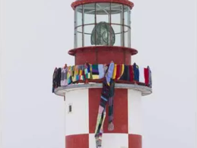 The lighthouse at the Museum of Science and Technology Museum was adorned with knit scarves commemorating Random Act Of Kindness Week February 12-18, 2017. ERROL MCGIHON / POSTMEDIA